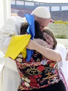Papa Francisco hugging 2 women in Morelia, Mexico